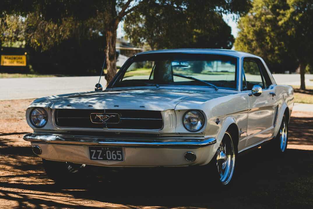 Silver car with restored bodywork after rust treatment
