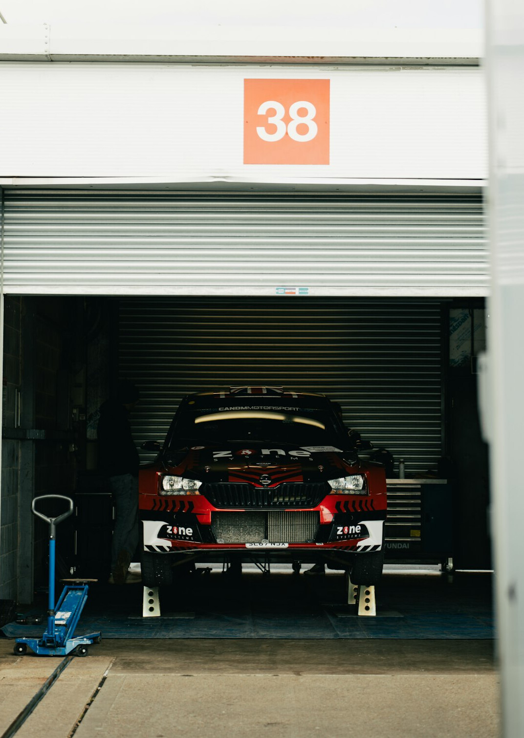 Car lifted in a professional repair garage